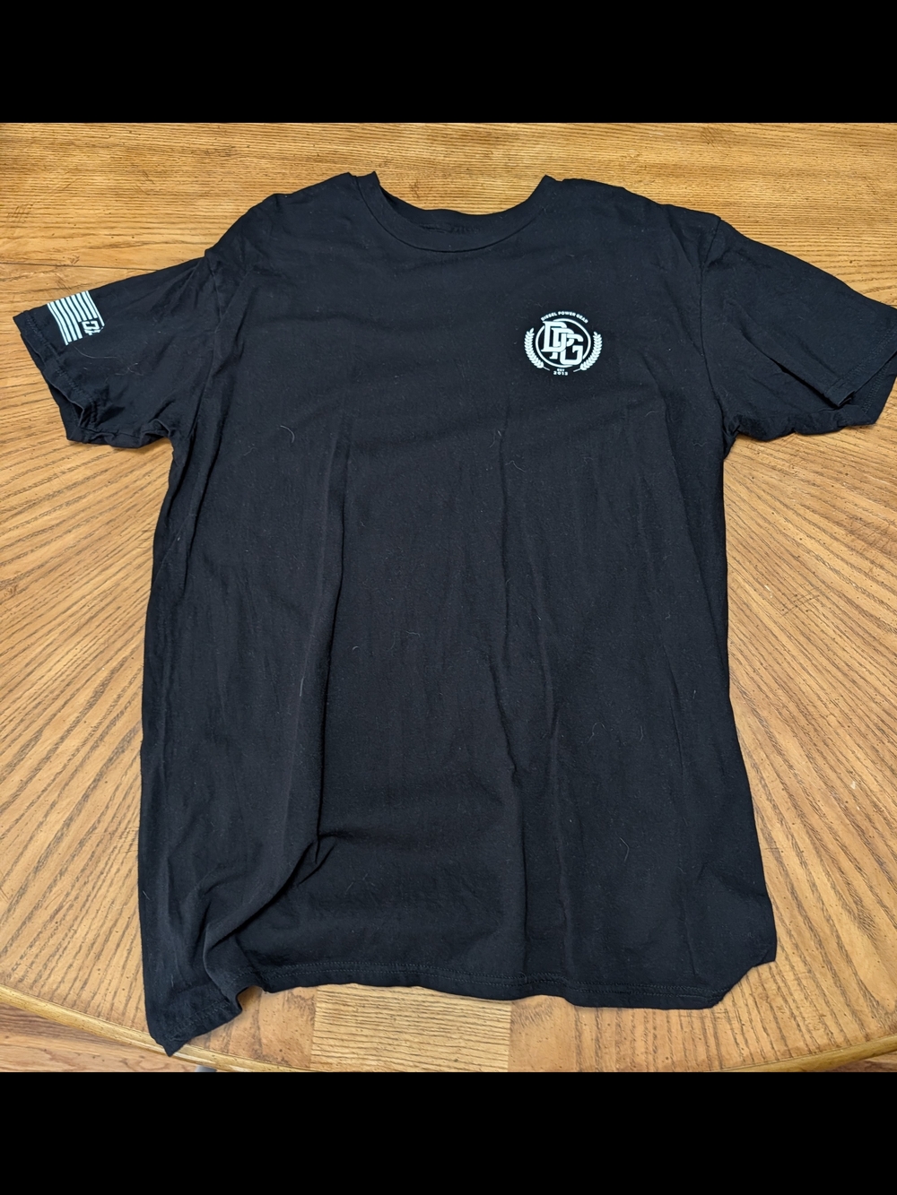 DPG Black Short Sleeve Tee with White Chest Emblem and Sleeve Logo